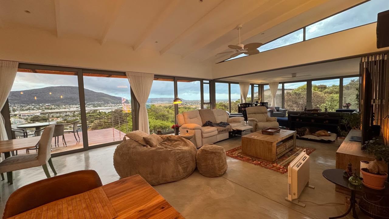 Living room with sea and mountain views